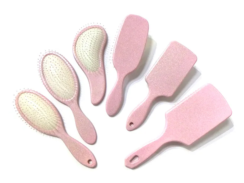 Spazzola per capelli a paletta fantasia in plastica rosa