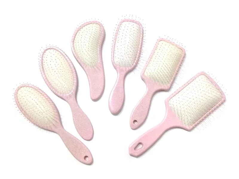Spazzola per capelli a paletta fantasia in plastica rosa