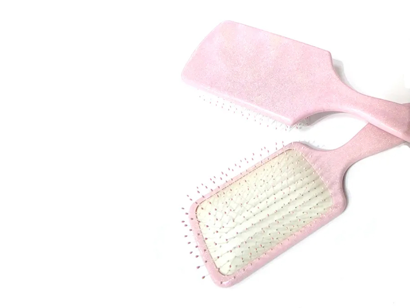 Spazzola per capelli a paletta fantasia in plastica rosa