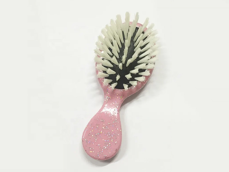 Mini spazzola per capelli colorata districante per bambini