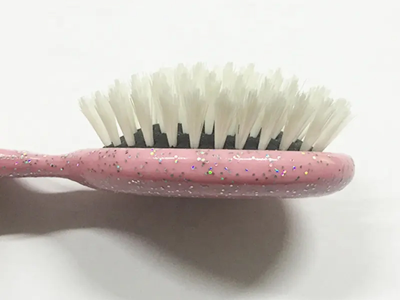 Mini spazzola per capelli colorata districante per bambini