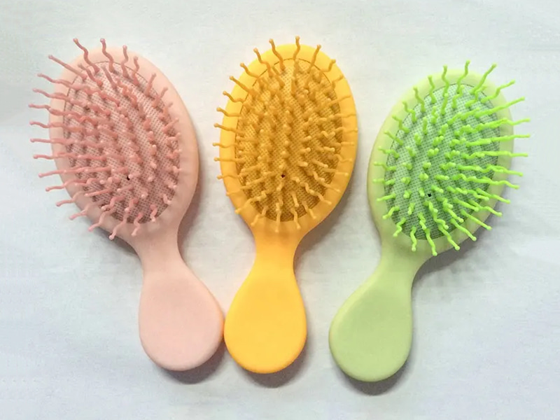 Mini spazzola per capelli colorata districante per bambini
