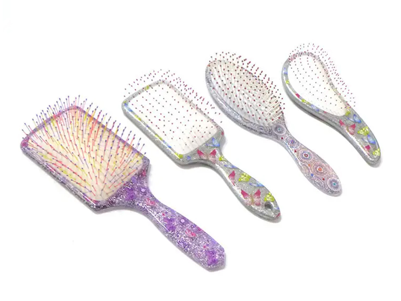 Mini spazzola per capelli districante in plastica morbida al tatto