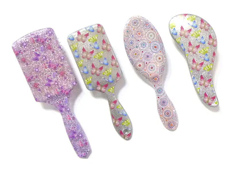 Mini spazzola per capelli districante in plastica morbida al tatto