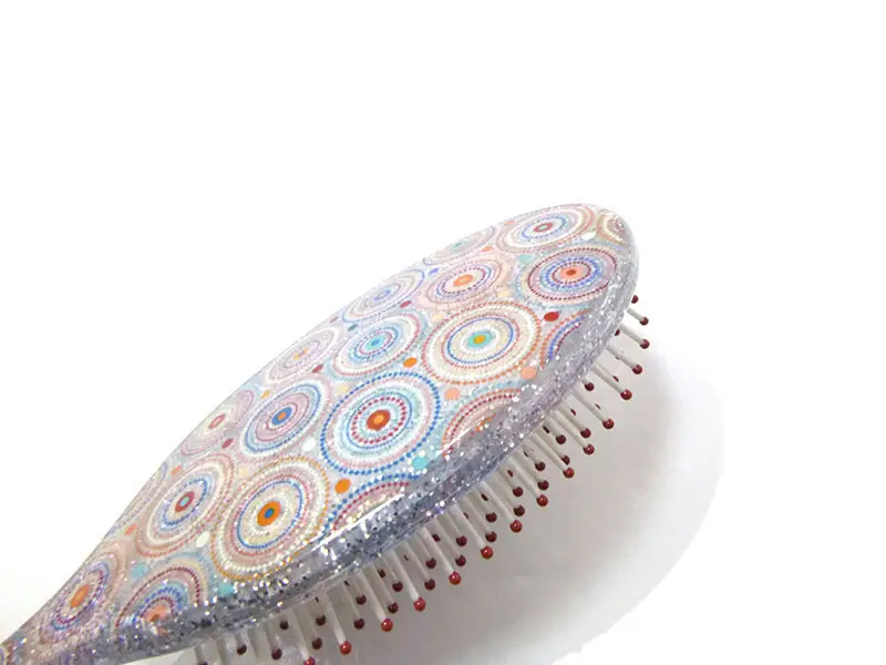 Mini spazzola per capelli districante in plastica morbida al tatto