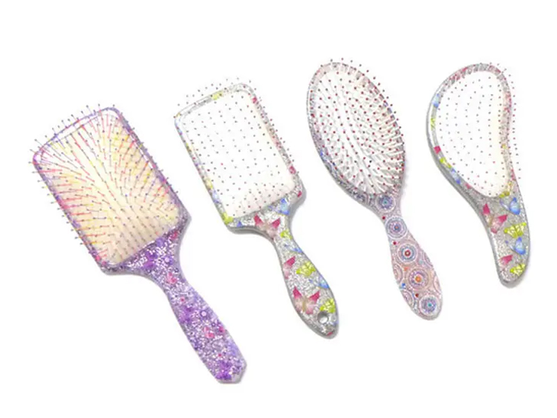 Mini spazzola per capelli districante in plastica morbida al tatto