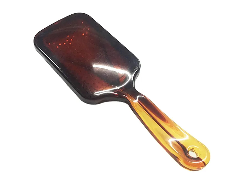 Spazzola per capelli paddle color ambra con perni in metallo
