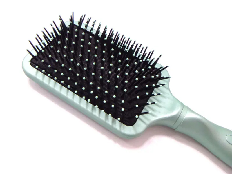 Piastra per capelli con spazzole per asciugatura