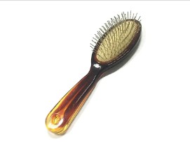 In che modo una spazzola per capelli da massaggio apporta benefici alla salute del cuoio capelluto e dei capelli?
